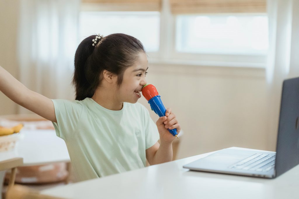 girl singing into microphone