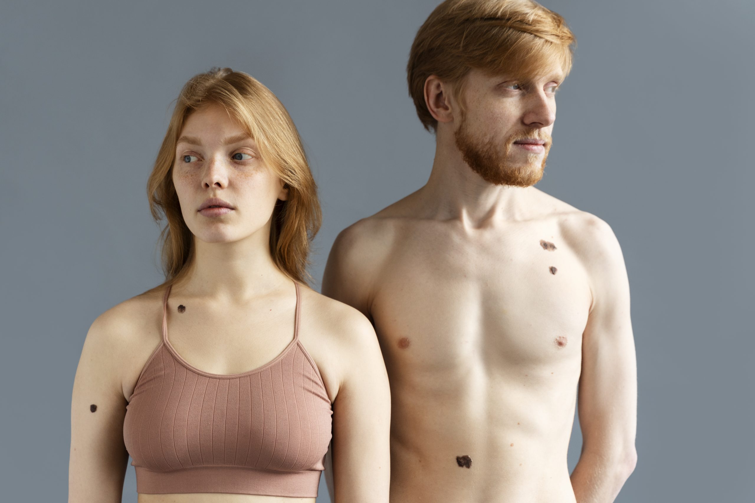 Teenage boy and girl standing